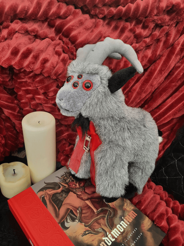 Peluche - bouc aux multiples yeux rouges